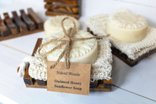 Oatmeal Sunflower Soap Bundle with oatmeal honey soap, wooden soap dish, and sisal bag, tied with rustic jute twine