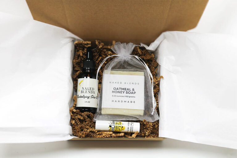 Body and Lip Care Set with soap, skin oil, and lip balm in a box with tissue and crinkle paper