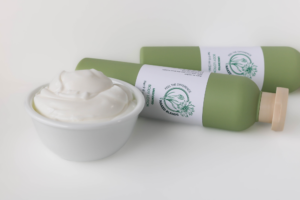 Unscented Lotion with lotion in a bowl in front of it.