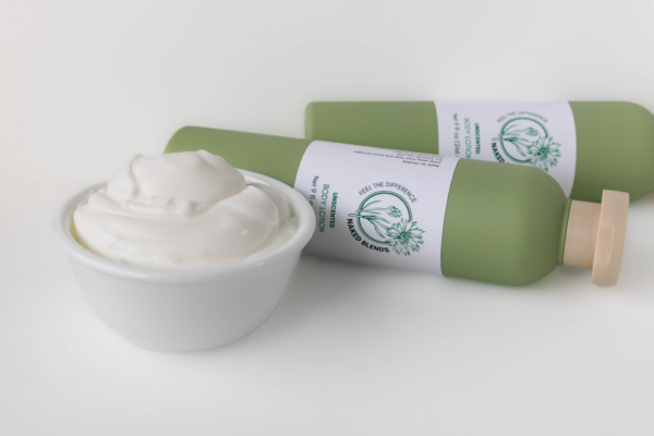 Unscented Lotion with lotion in a bowl in front of it.